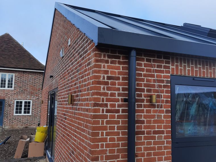 Custom steel roofline at home gym